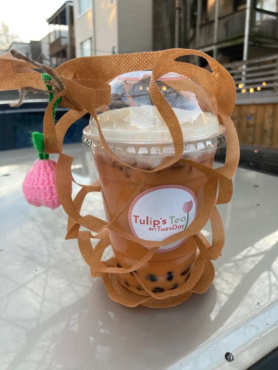 Milk tea in the shop’s little paper carrier